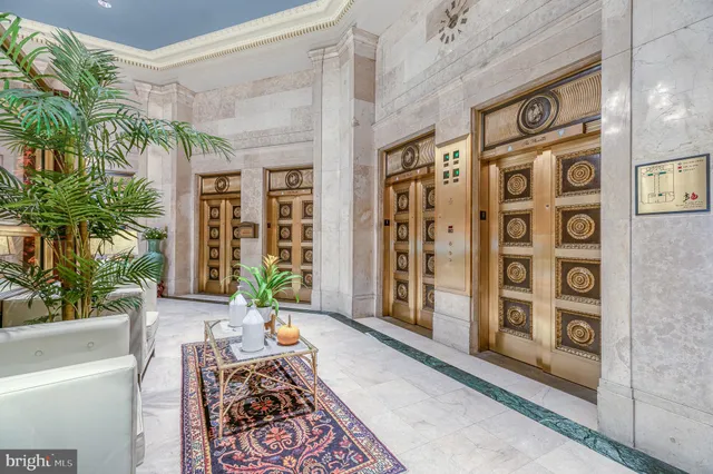 a front view of a house with a potted plant