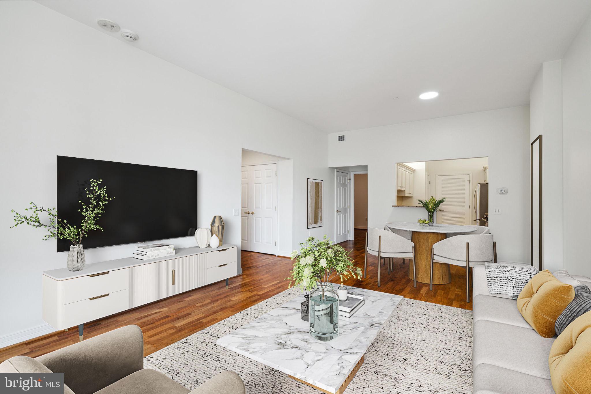 1600 Arch Street, Unit 1113 Philadelphia, PA 19103 - Photo 4 of 34 a living room with furniture and a flat screen tv