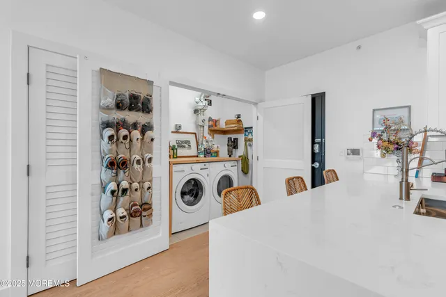 a bedroom with a bed and a white cabinet