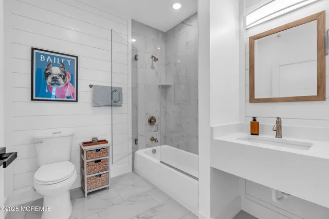 a bathroom with a toilet a sink and a bathtub