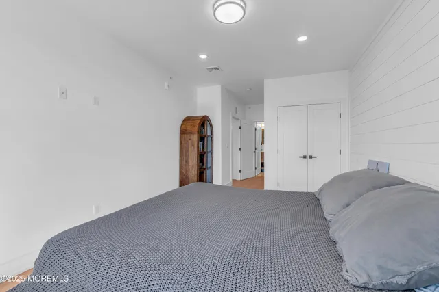 a view of a bedroom with closet