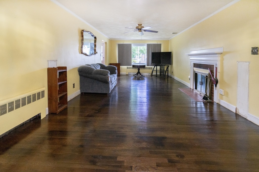 5 Hampton Street Saugus, MA 01906 - Photo 14 of 24 a living room with furniture and a fireplace