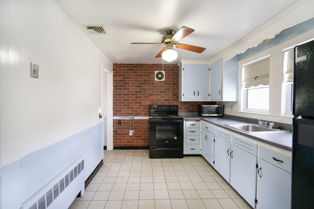 5 Hampton Street Saugus, MA 01906 - Photo 15 of 24 a kitchen with a cabinets and appliances