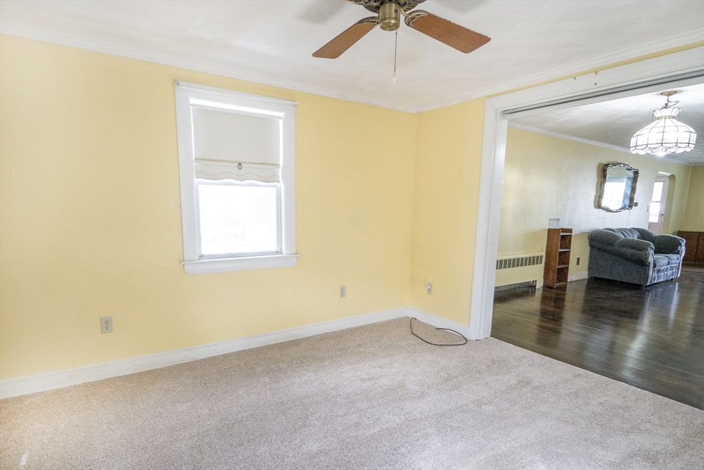 5 Hampton Street Saugus, MA 01906 - Photo 18 of 24 a view of a livingroom with wooden floor and a ceiling fan
