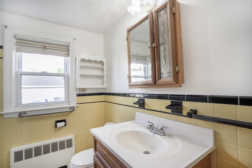 5 Hampton Street Saugus, MA 01906 - Photo 21 of 24 a bathroom with a sink a toilet and tub