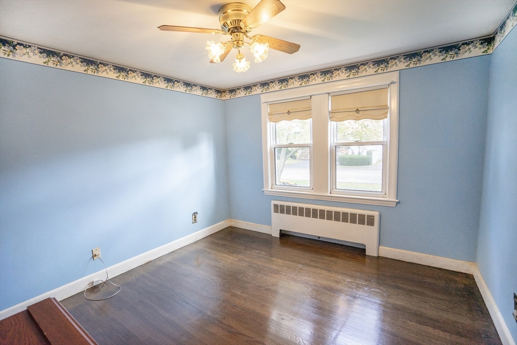 5 Hampton Street Saugus, MA 01906 - Photo 23 of 24 a view of an empty room with a window and wooden floor