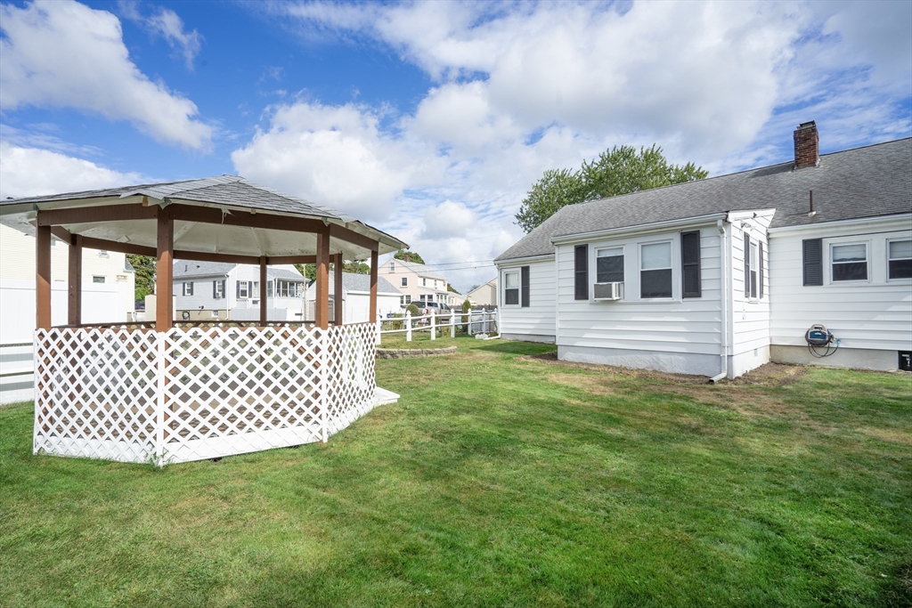 5 Hampton Street Saugus, MA 01906 - Photo 6 of 24 a front view of a house with a garden