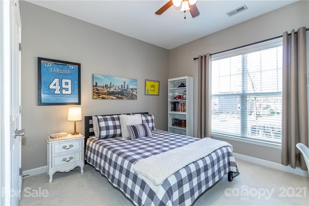 4128 Walker Road Charlotte, NC 28211 - Photo 26 of 31 a bedroom with a large bed and a window
