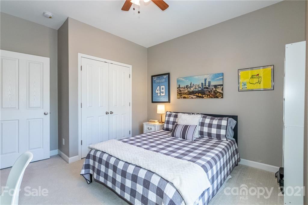 4128 Walker Road Charlotte, NC 28211 - Photo 27 of 31 a bedroom with a bed and painting on the wall