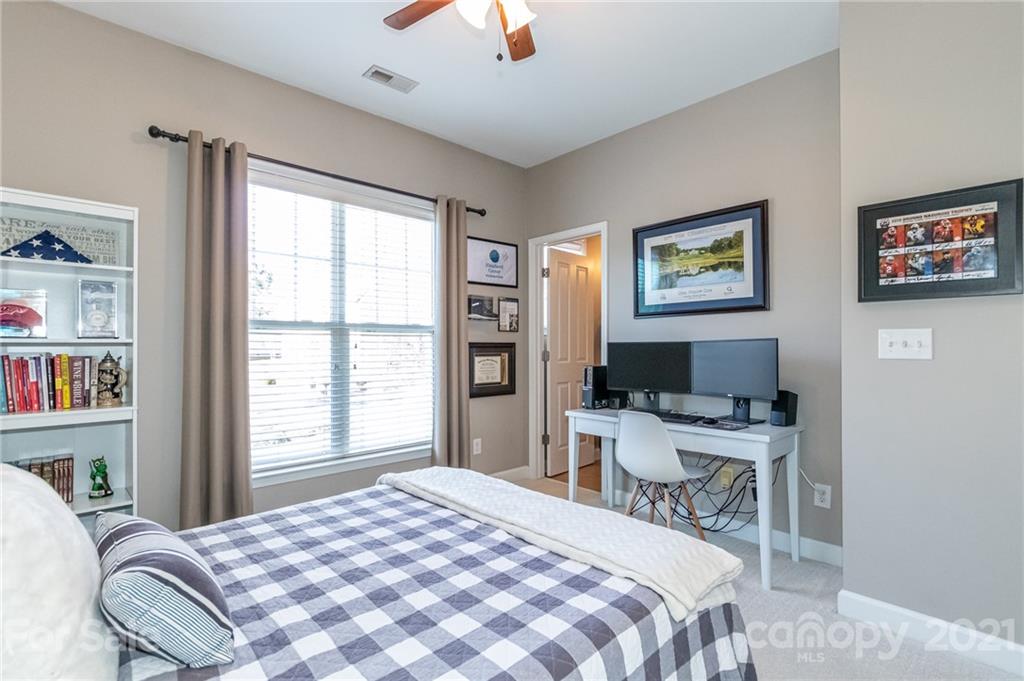 4128 Walker Road Charlotte, NC 28211 - Photo 28 of 31 a bedroom with a bed and a workspace