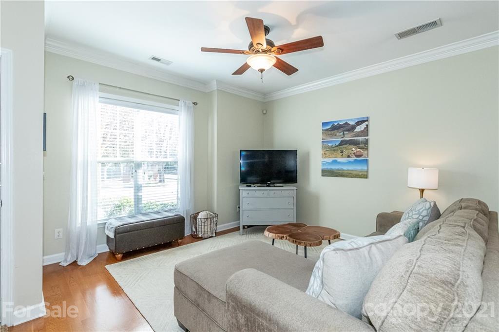 4128 Walker Road Charlotte, NC 28211 - Photo 5 of 31 a living room with furniture and a flat screen tv