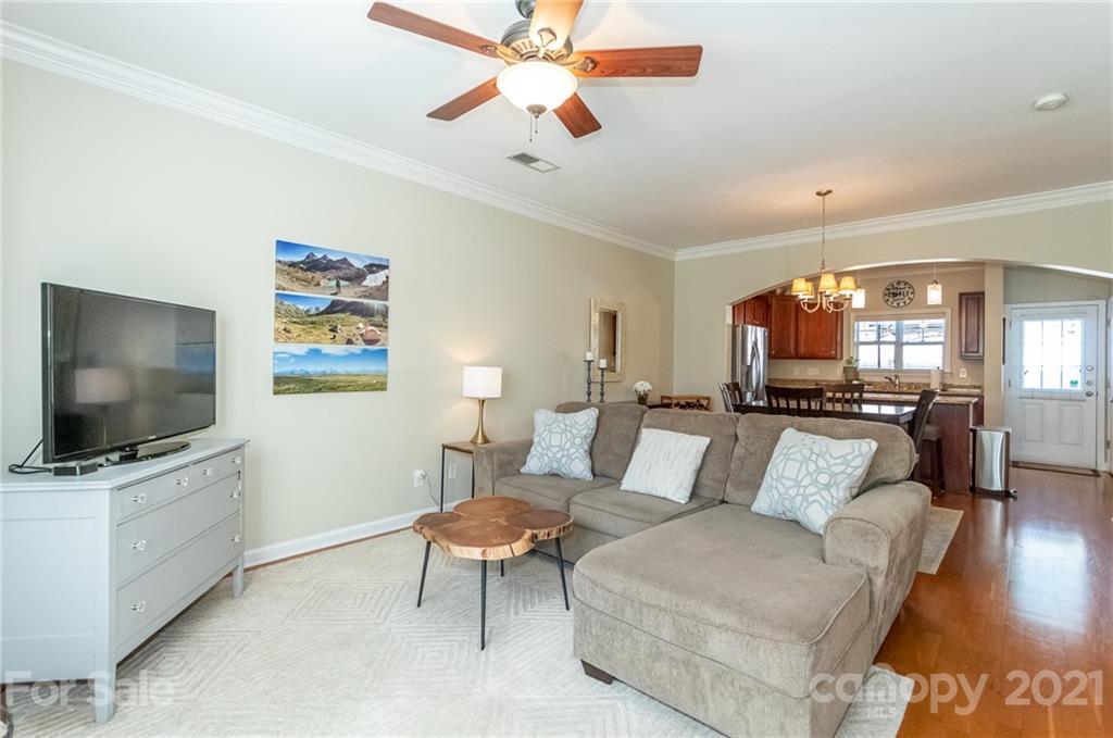 4128 Walker Road Charlotte, NC 28211 - Photo 7 of 31 a living room with furniture and a flat screen tv