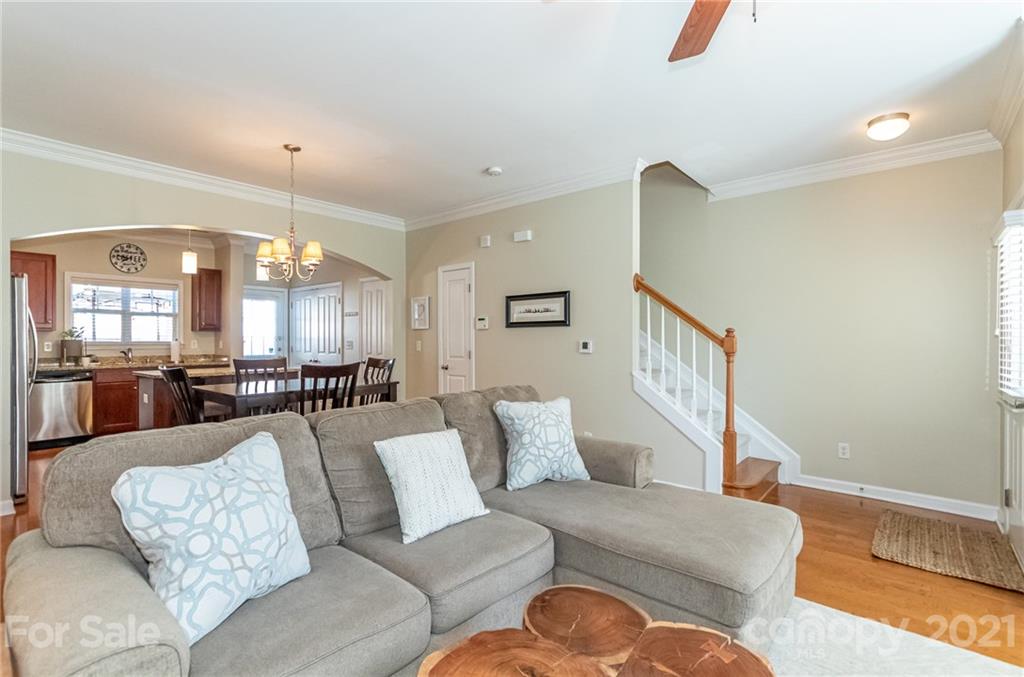 4128 Walker Road Charlotte, NC 28211 - Photo 8 of 31 a living room with furniture and a view of kitchen