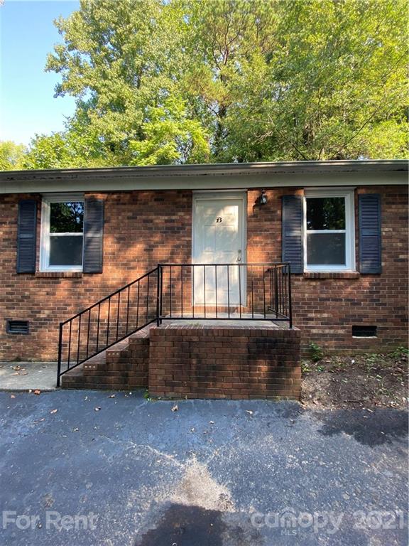 562 Rhyne Street North, Unit B Gastonia, NC 28054 - Photo 1 of 9 a view of a small house with a yard
