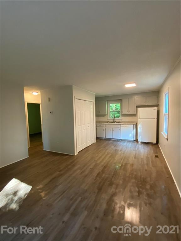 562 Rhyne Street North, Unit B Gastonia, NC 28054 - Photo 3 of 9 a view of empty room with wooden floor