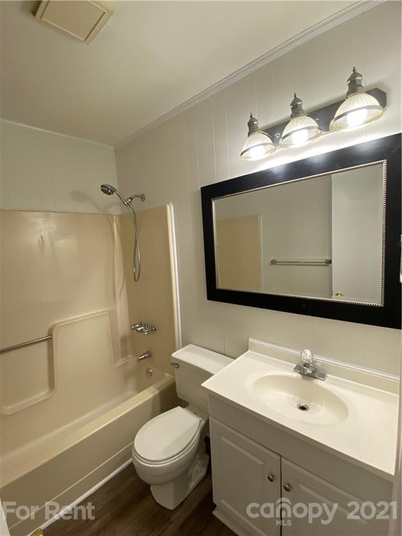 562 Rhyne Street North, Unit B Gastonia, NC 28054 - Photo 7 of 9 a bathroom with a sink toilet and shower
