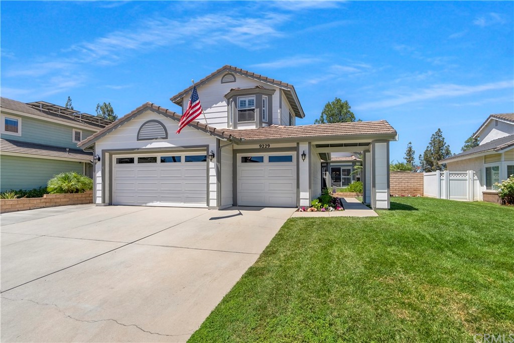 9229 Loquat Drive Riverside, CA 92508 - Photo 1 of 1 front view of a house with a yard