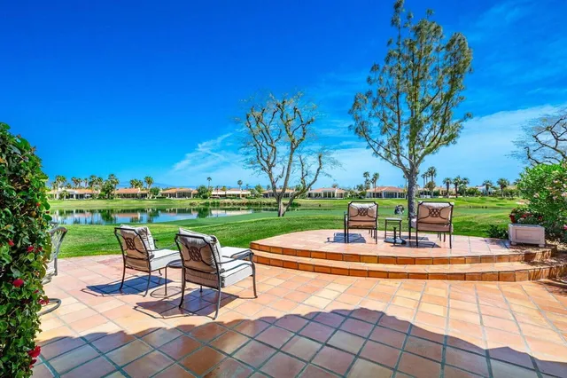 a house view with a seating space and a garden view