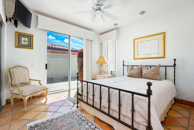 a bedroom with furniture and a window