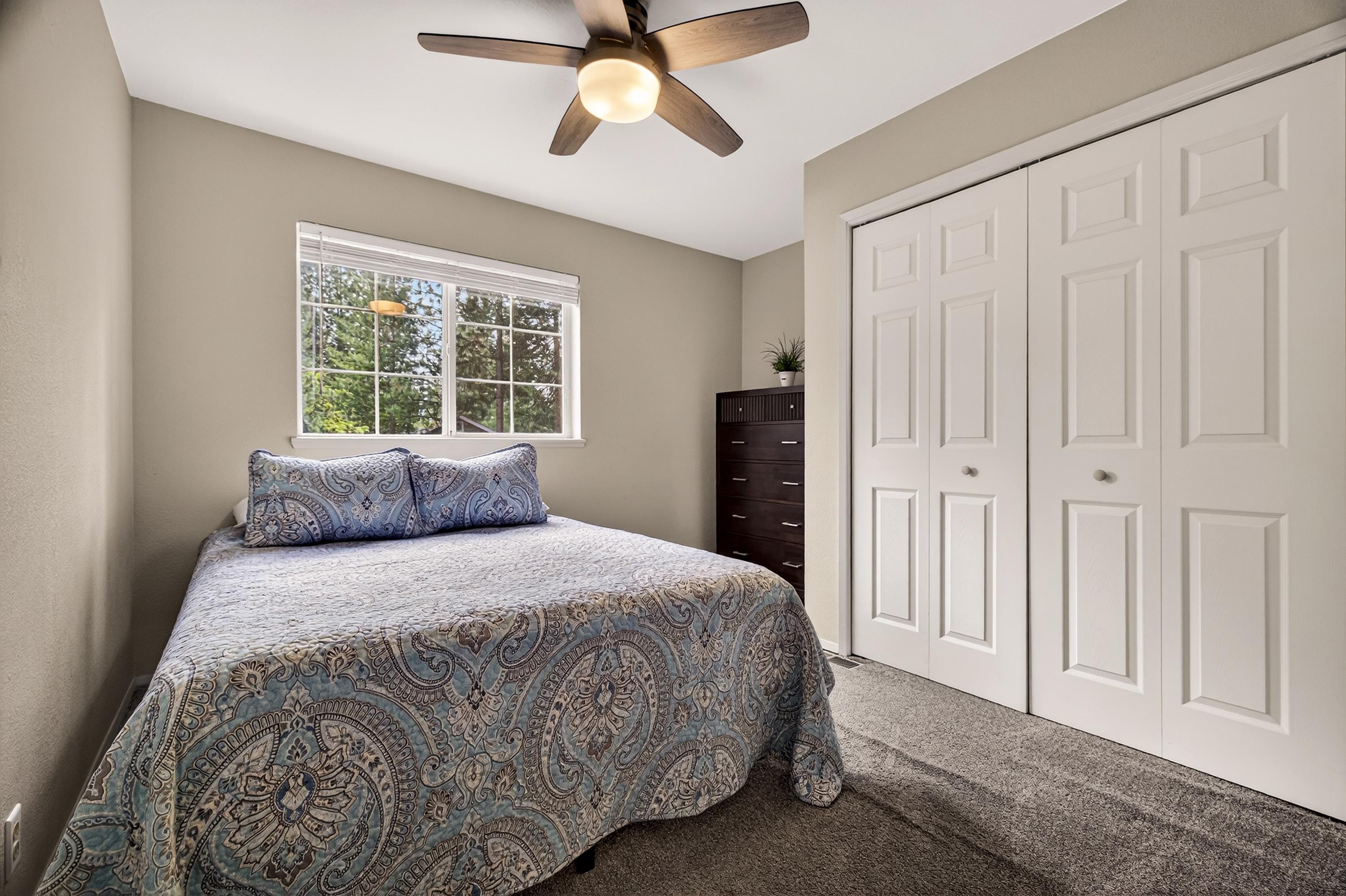 811 Golf Club Road Lake Almanor, CA 96137 - Photo 26 of 42 a bedroom with a bed and a window