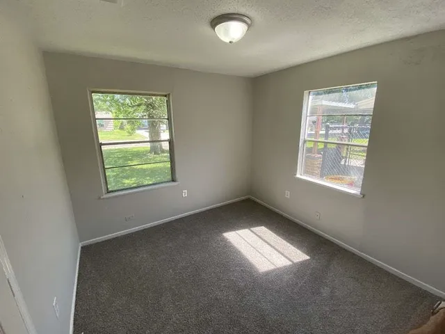 an empty room with windows