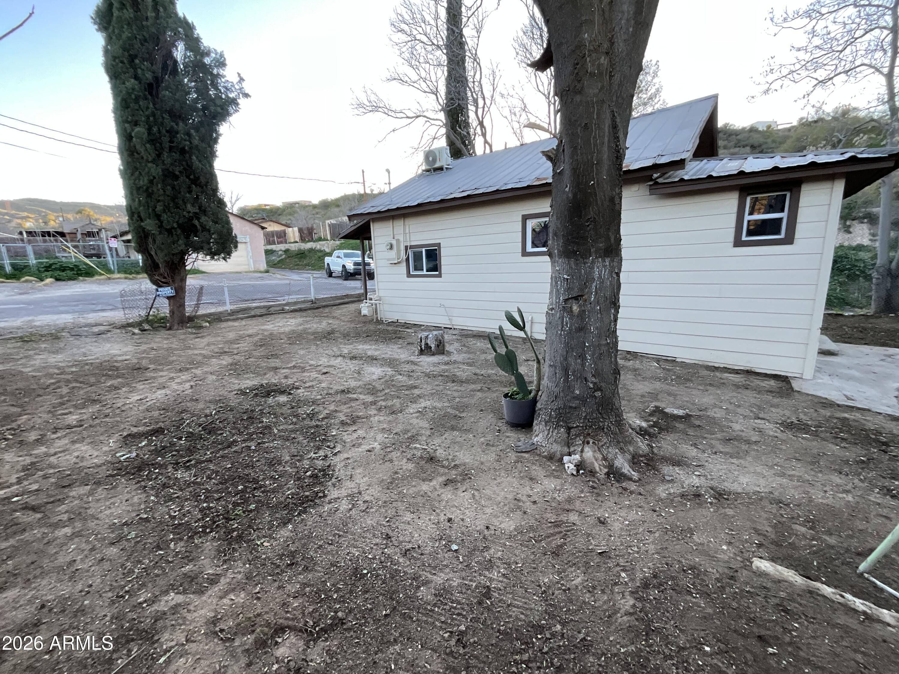 4382 East Copper Street Claypool, AZ 85532 - Photo 8 of 10 a view of a house with a yard and tree