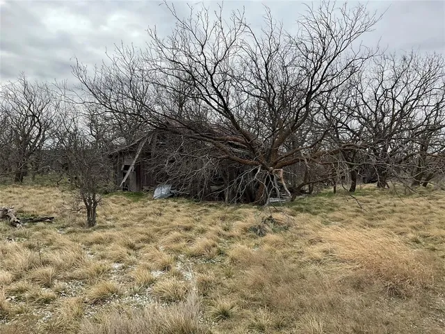 a fire hydrant in the middle of a field