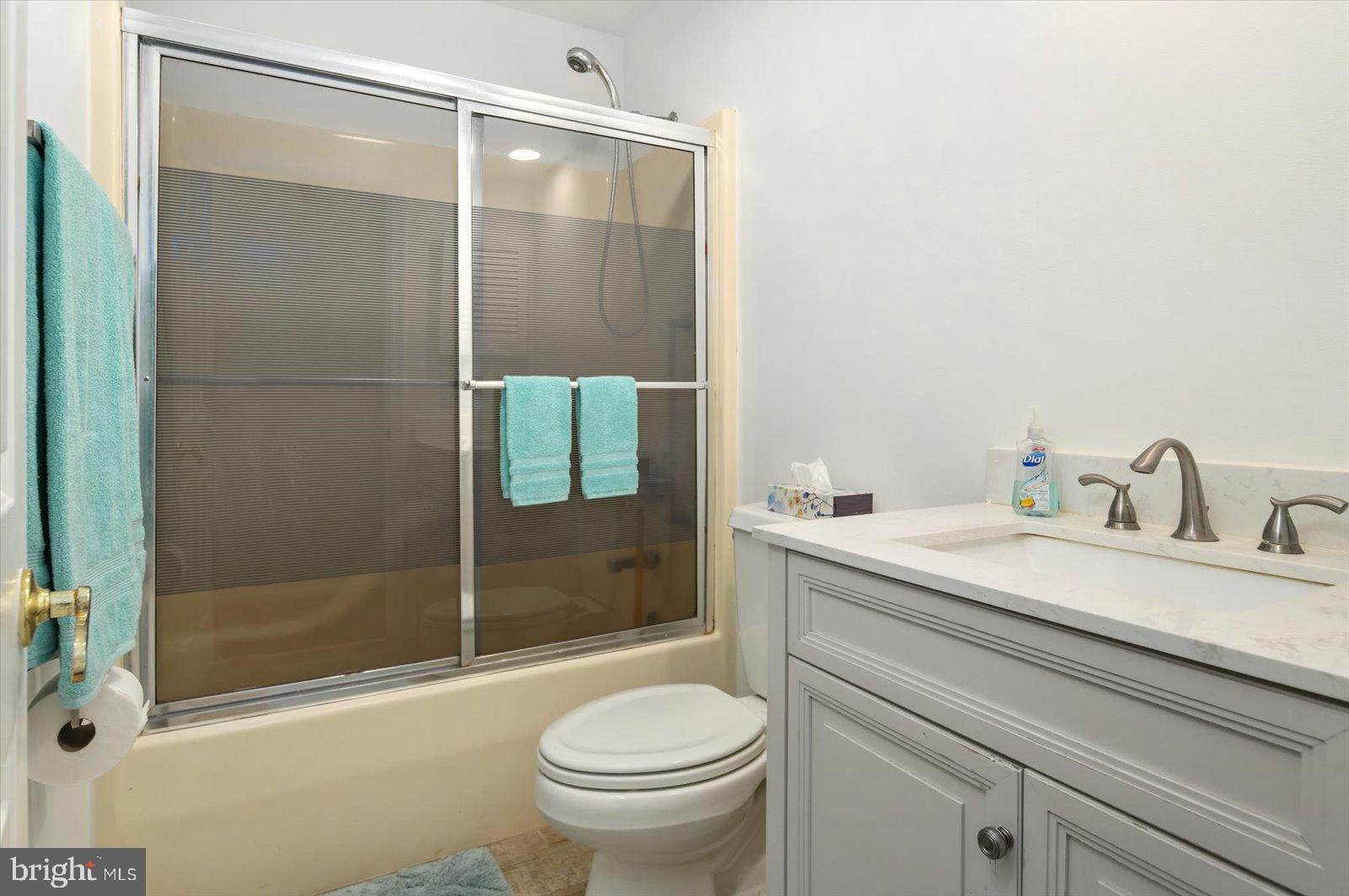 68 Falcon Bridge Road Berlin, MD 21811 - Photo 26 of 71 a bathroom with a sink toilet and shower