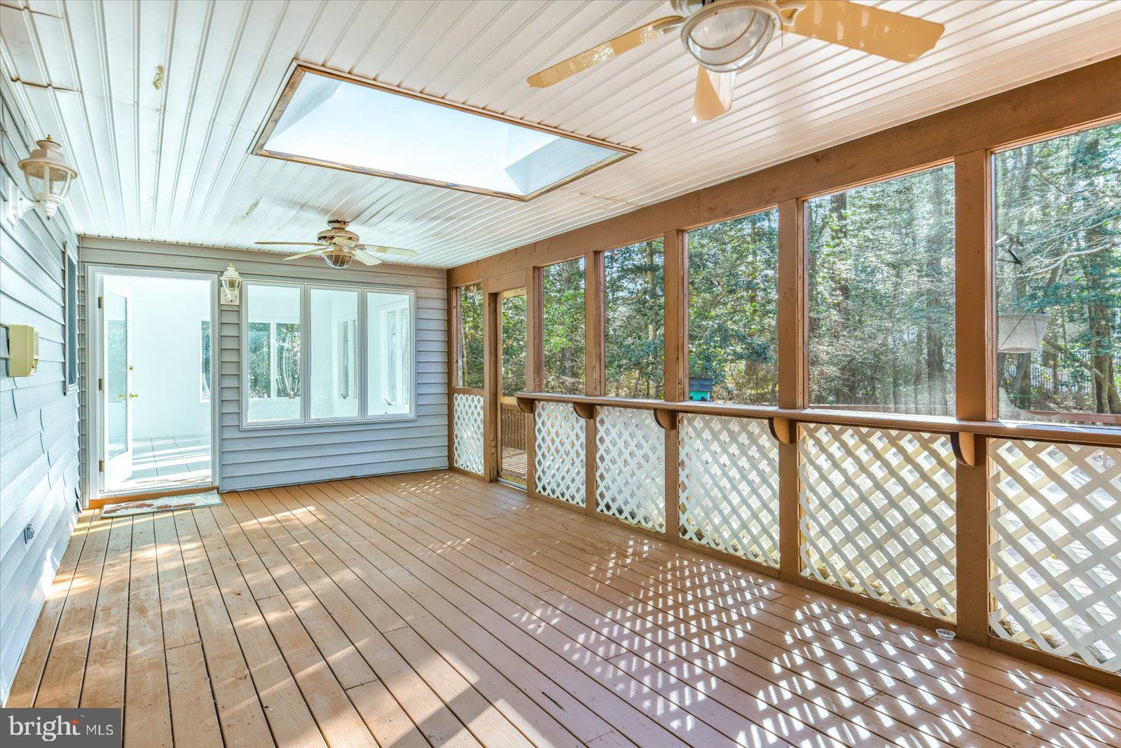 68 Falcon Bridge Road Berlin, MD 21811 - Photo 35 of 71 a view of a room with wooden floor and windows