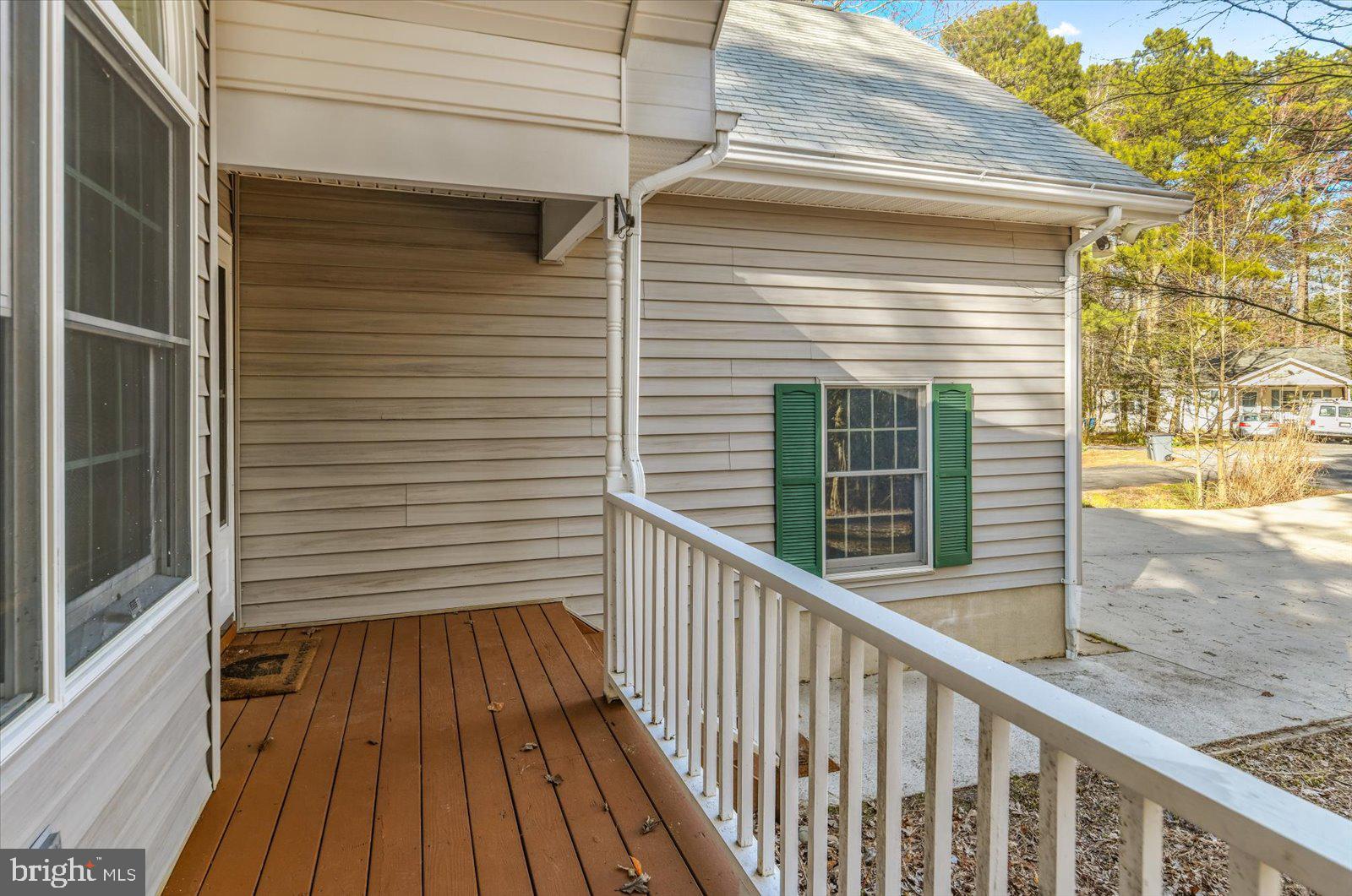 68 Falcon Bridge Road Berlin, MD 21811 - Photo 50 of 71 a view of a balcony with wooden floor