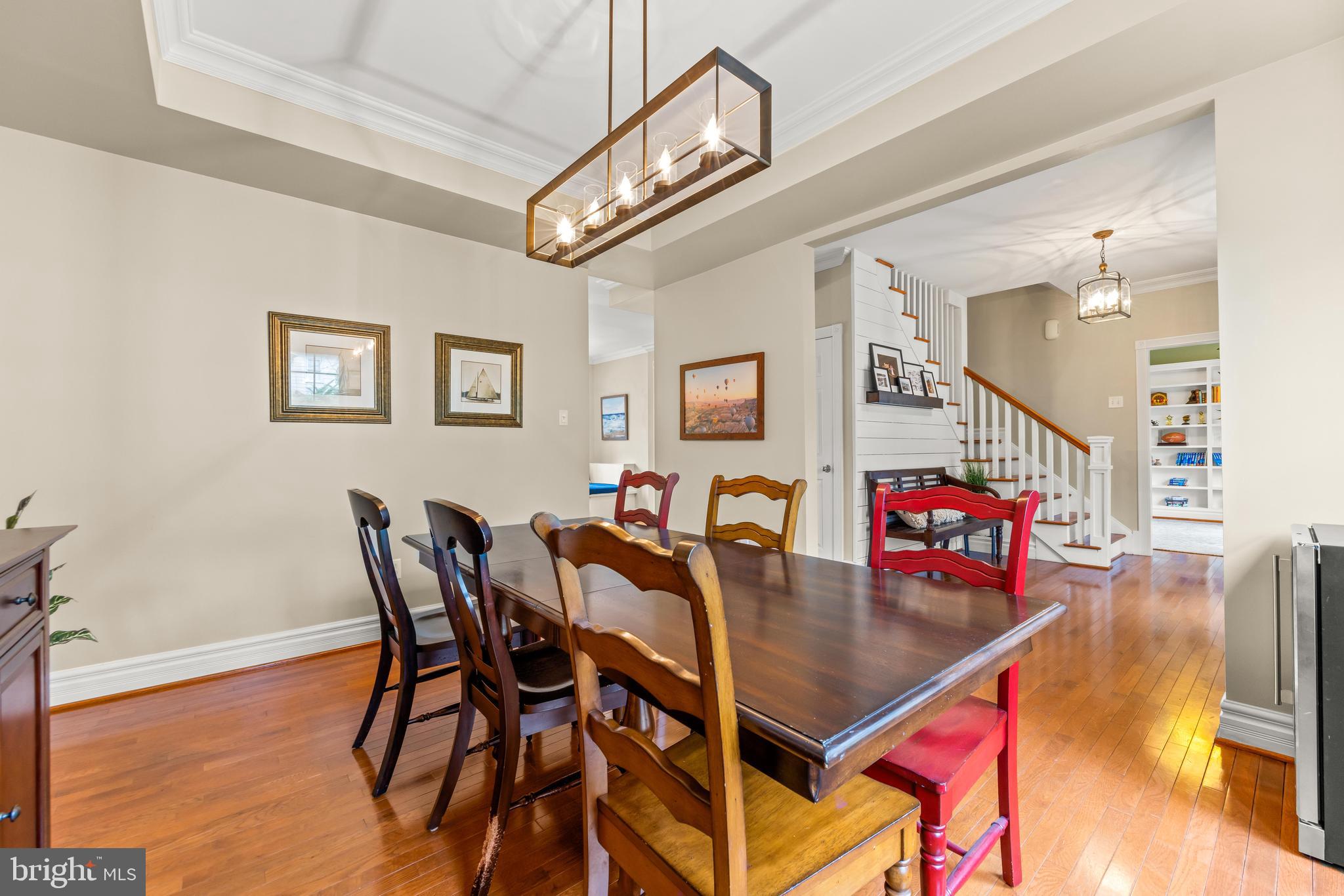 776 Snodgrass Road Crownsville, MD 21032 - Photo 19 of 82 a view of a dining room with furniture and a chandelier