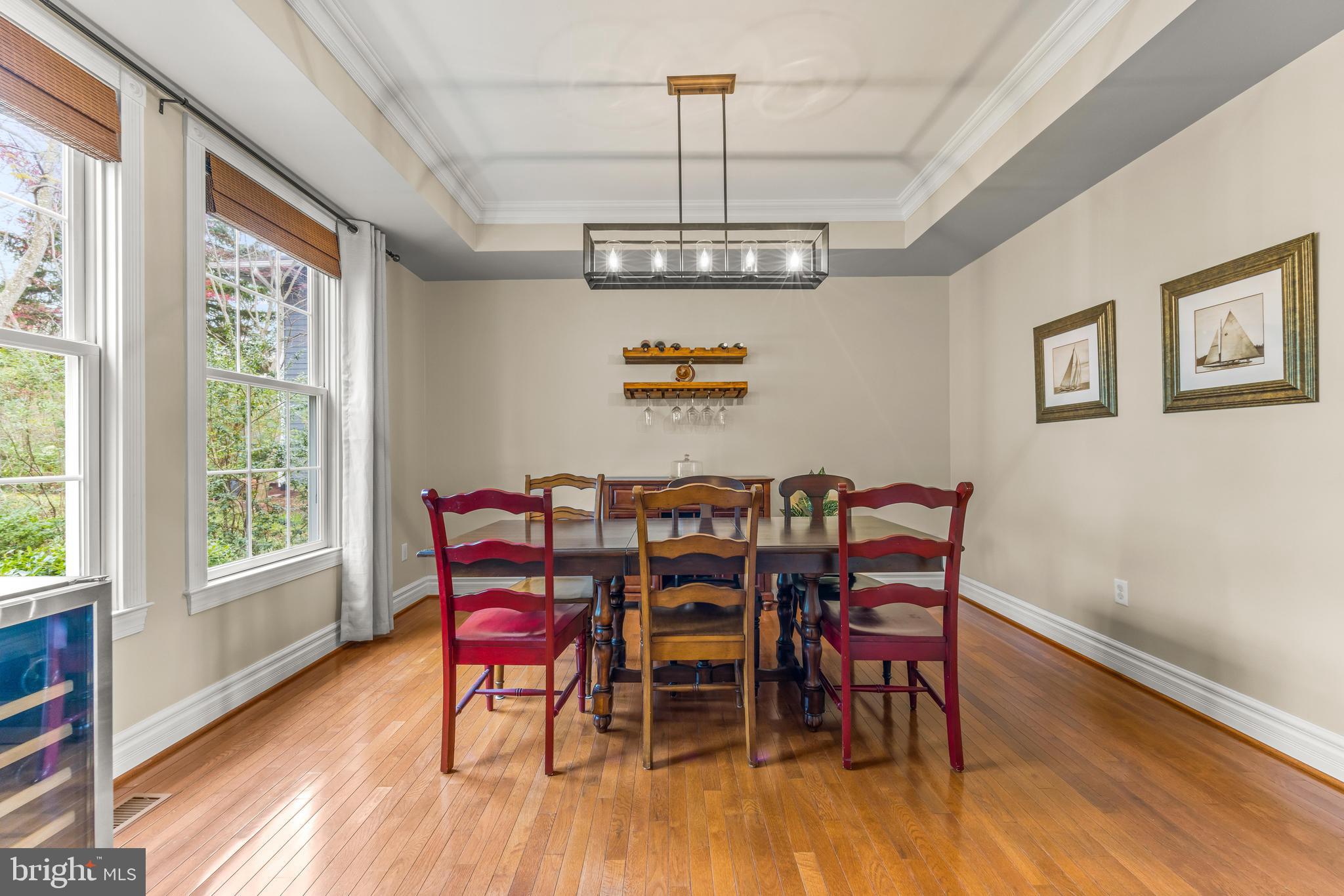 776 Snodgrass Road Crownsville, MD 21032 - Photo 22 of 82 a view of a dining room with furniture window and wooden floor