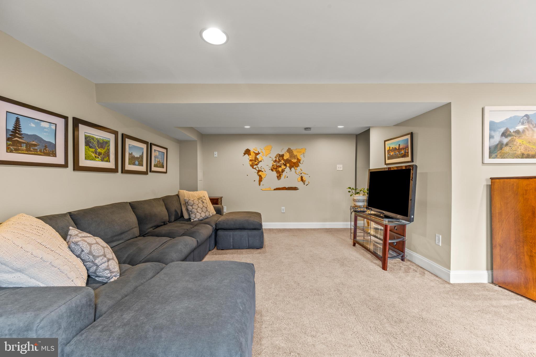 776 Snodgrass Road Crownsville, MD 21032 - Photo 35 of 82 a living room with furniture and a flat screen tv