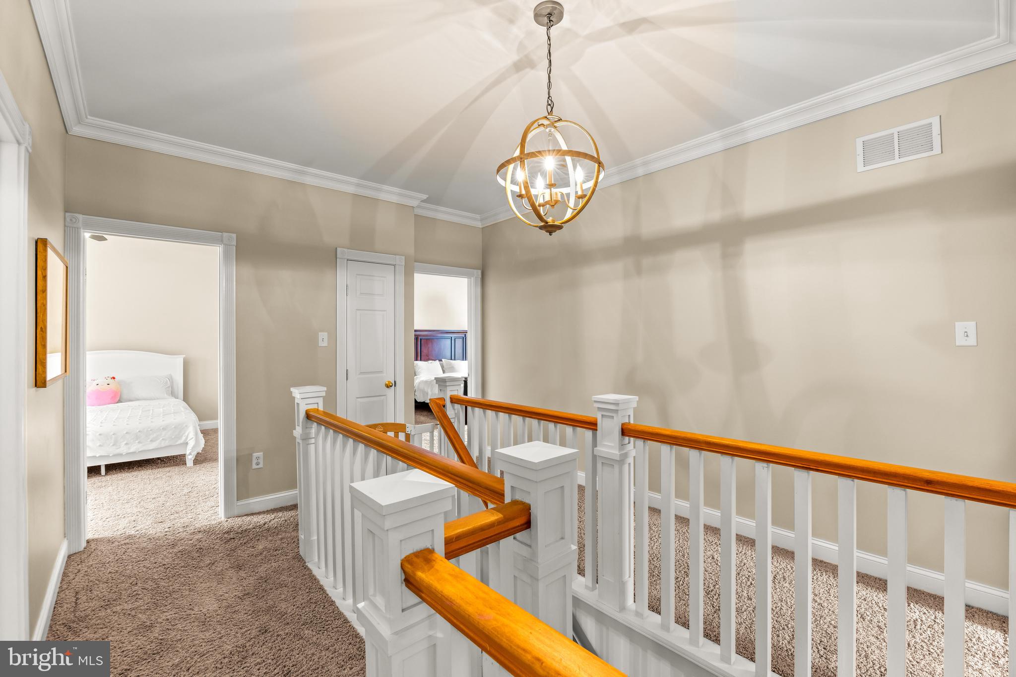 776 Snodgrass Road Crownsville, MD 21032 - Photo 38 of 82 a view of an entryway wooden floor and a chandelier