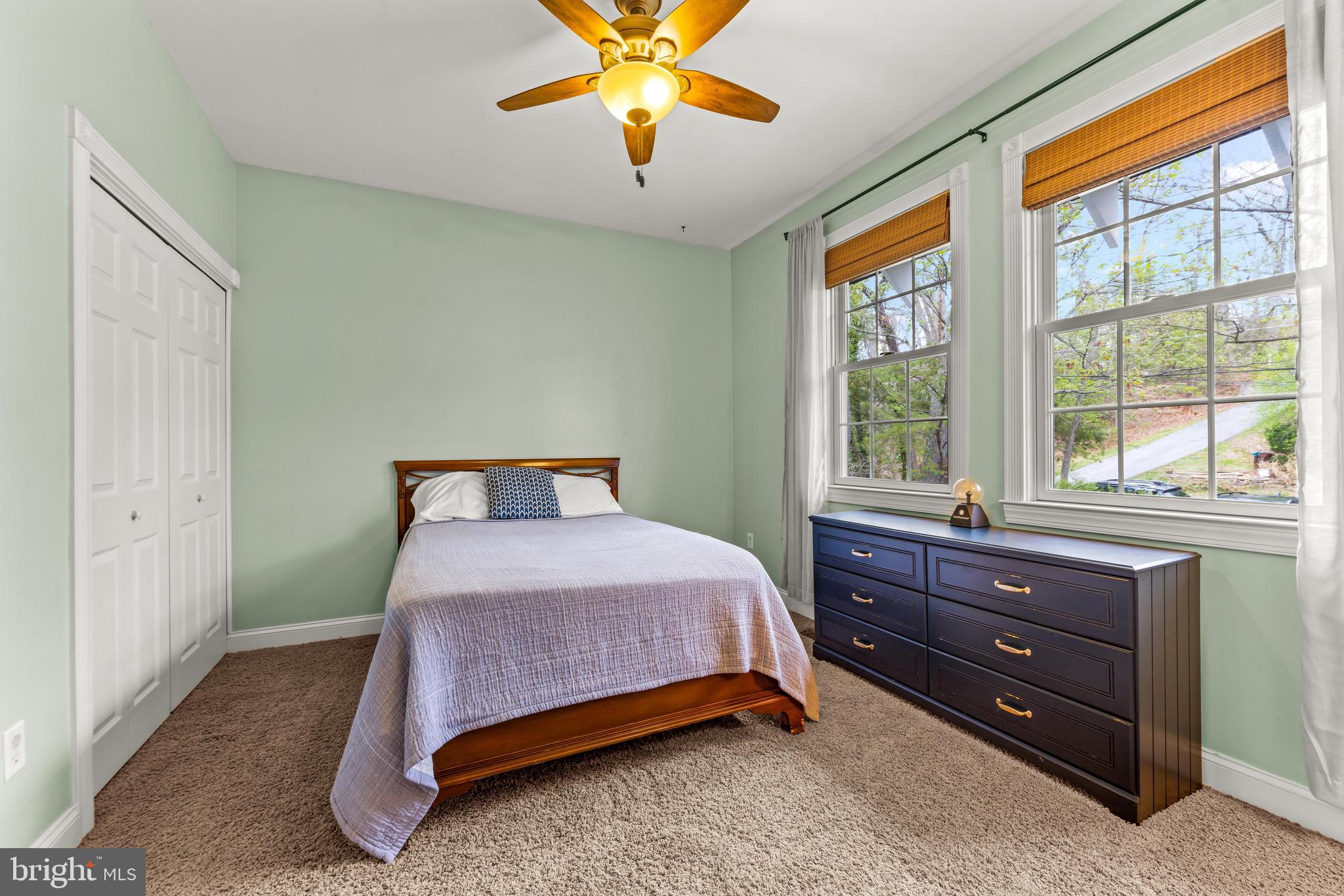 776 Snodgrass Road Crownsville, MD 21032 - Photo 41 of 82 a bedroom with a bed and a chandelier
