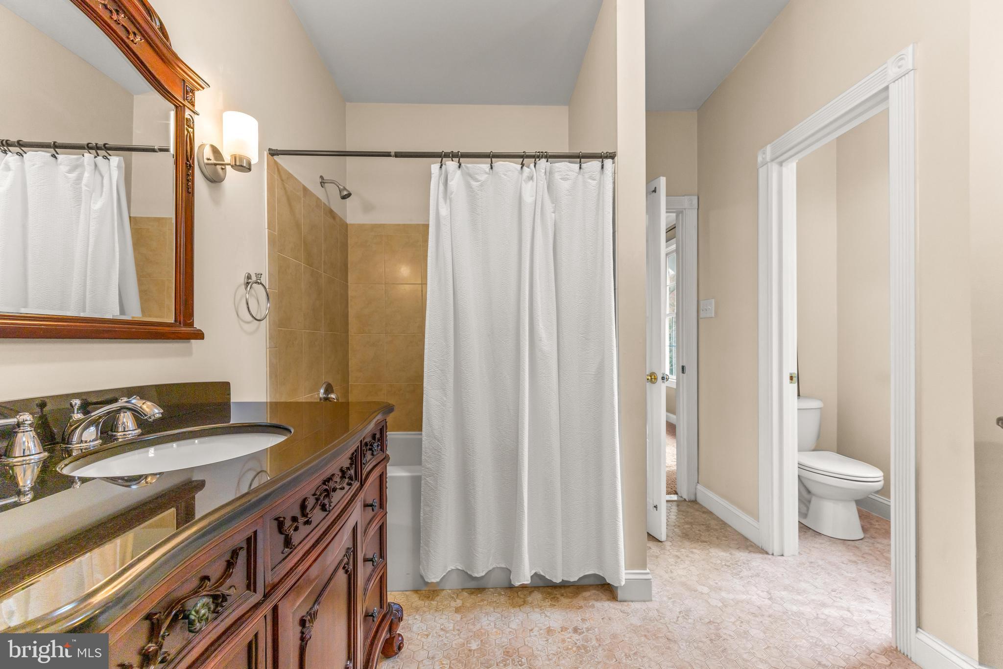 776 Snodgrass Road Crownsville, MD 21032 - Photo 52 of 82 a bathroom with a sink a toilet and a shower