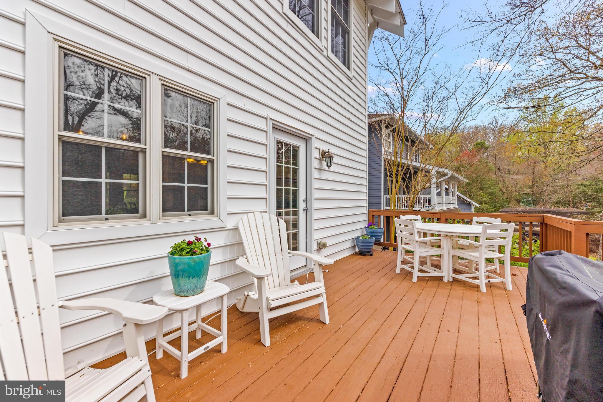 776 Snodgrass Road Crownsville, MD 21032 - Photo 56 of 82 a roof deck with table and chairs and potted plants