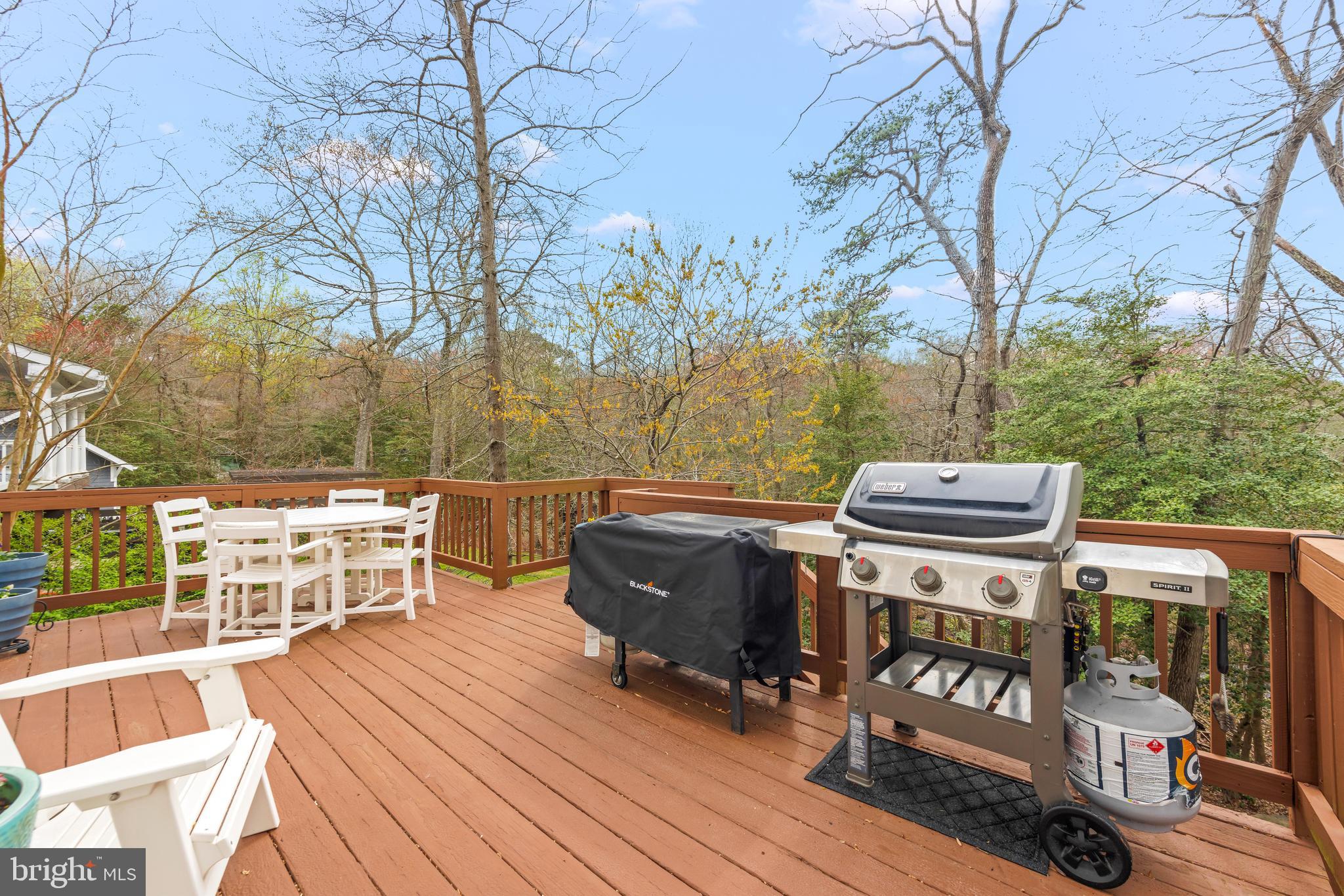 776 Snodgrass Road Crownsville, MD 21032 - Photo 57 of 82 a view of a roof deck with couches and wooden fence