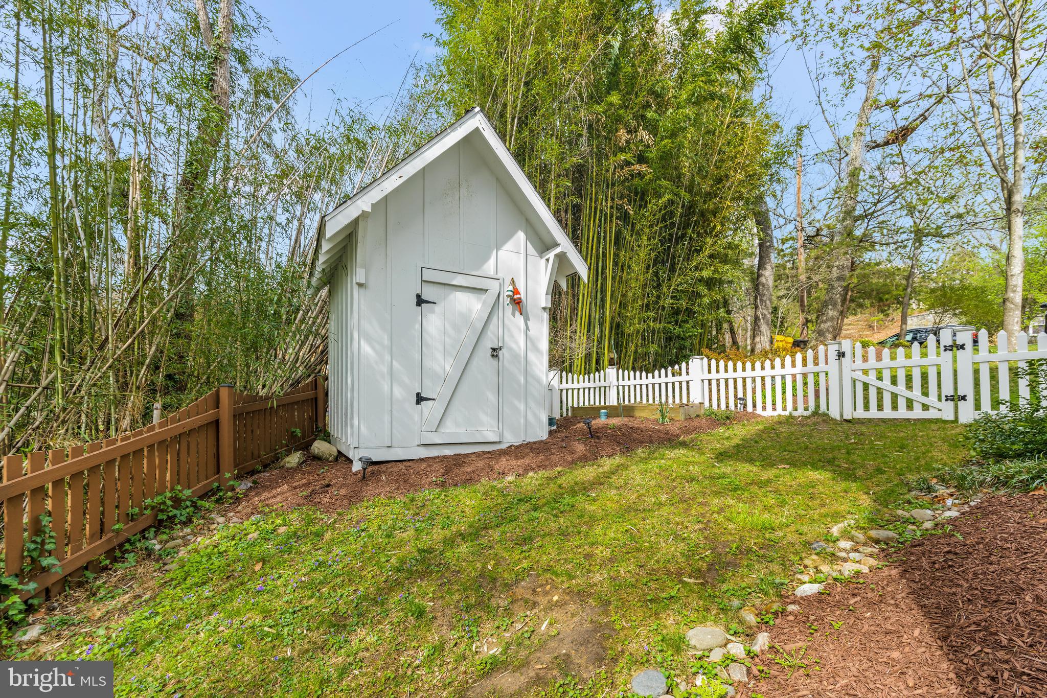 776 Snodgrass Road Crownsville, MD 21032 - Photo 68 of 82 a view of backyard with small garden and wooden fence