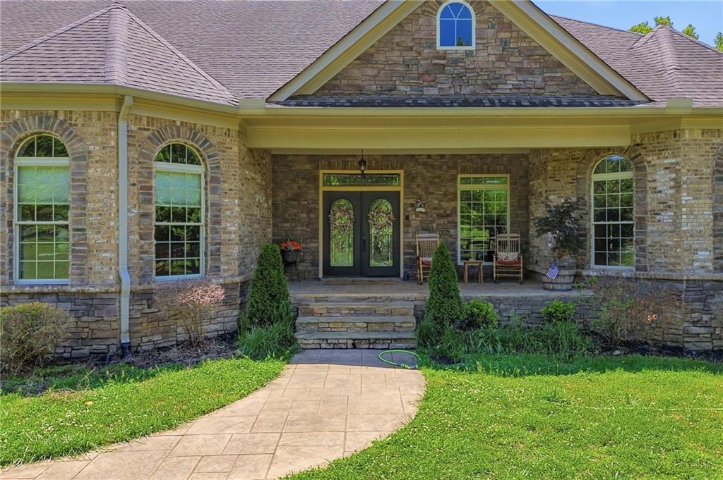 456 East Valley Road Northeast Rydal, GA 30171 - Photo 174 of 189 a front view of a house with garden