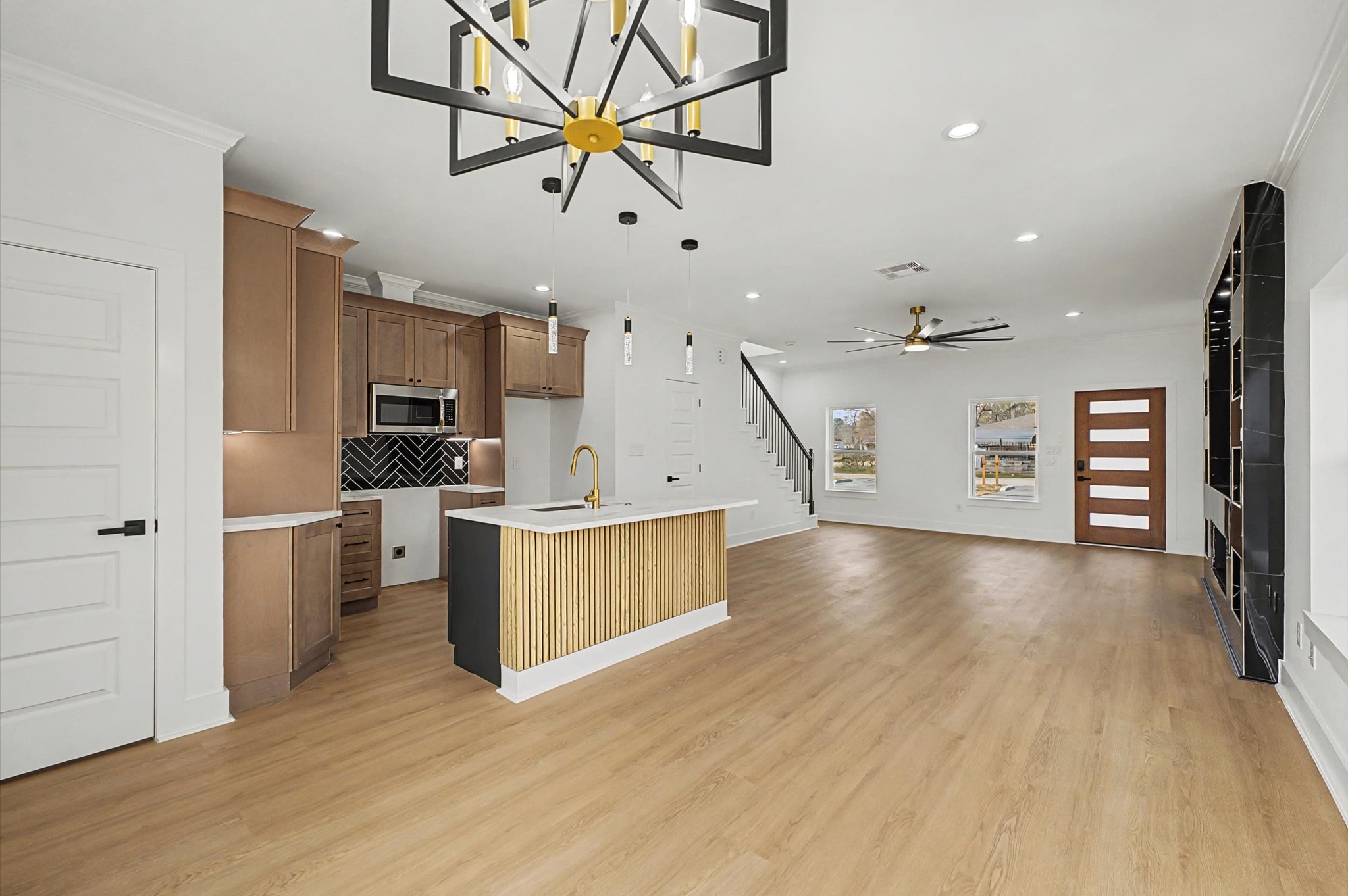 9214 Madera Road Houston, TX 77078 - Photo 7 of 24 a view of a kitchen with cabinets and wooden floor
