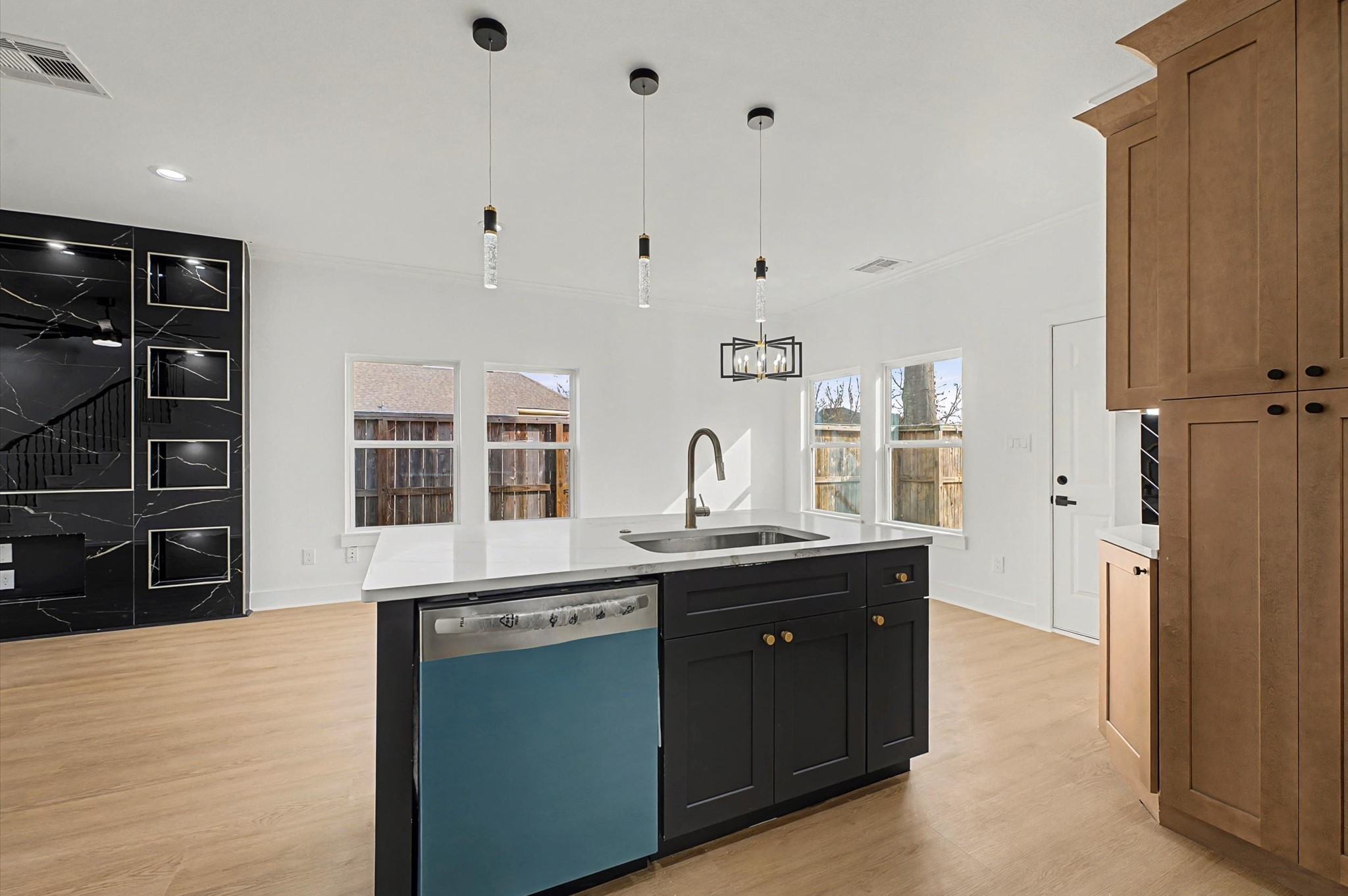 9214 Madera Road Houston, TX 77078 - Photo 8 of 24 a kitchen with stainless steel appliances granite countertop a sink and dishwasher with wooden floor