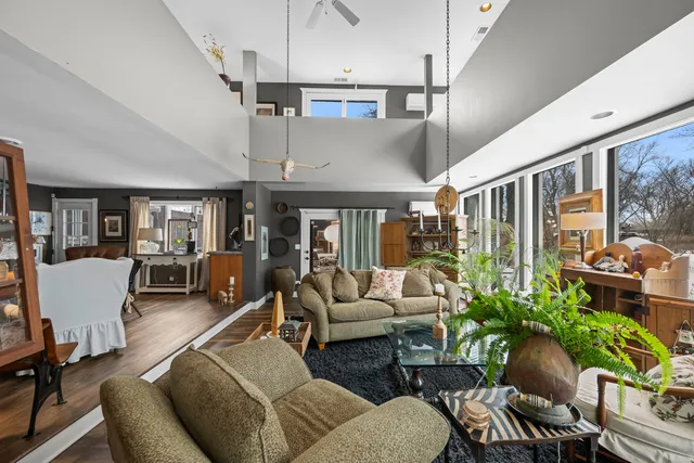a dining room with furniture and window