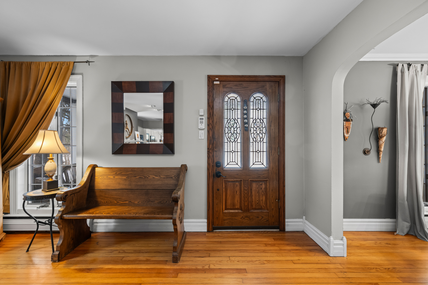 108 North Wheeling Road Prospect Heights, IL 60070 - Photo 17 of 54 a blue bench sitting in front of a window