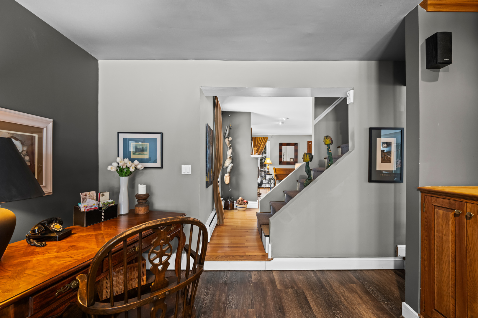 108 North Wheeling Road Prospect Heights, IL 60070 - Photo 20 of 54 a dining room with wooden floor and stairs