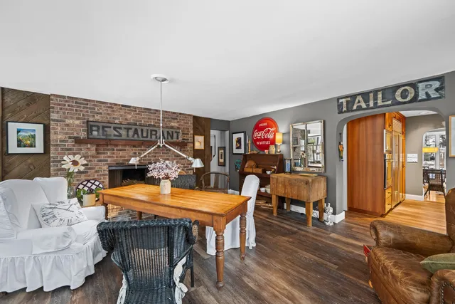 a view of a livingroom with furniture and a fireplace