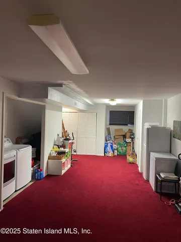 a bed room with a bed and a television