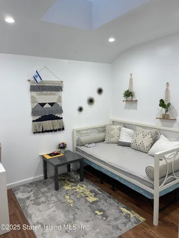 a living room with furniture and a rug