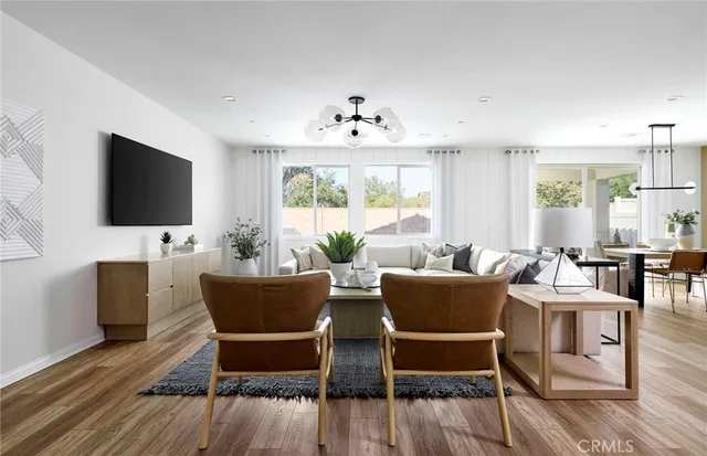 a view of a dining room with furniture window and wooden floor