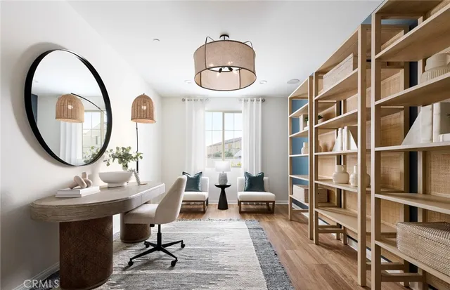 a living room with furniture a rug and a large window